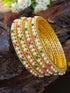 Gold Plated studded set of 4 pearl bangles