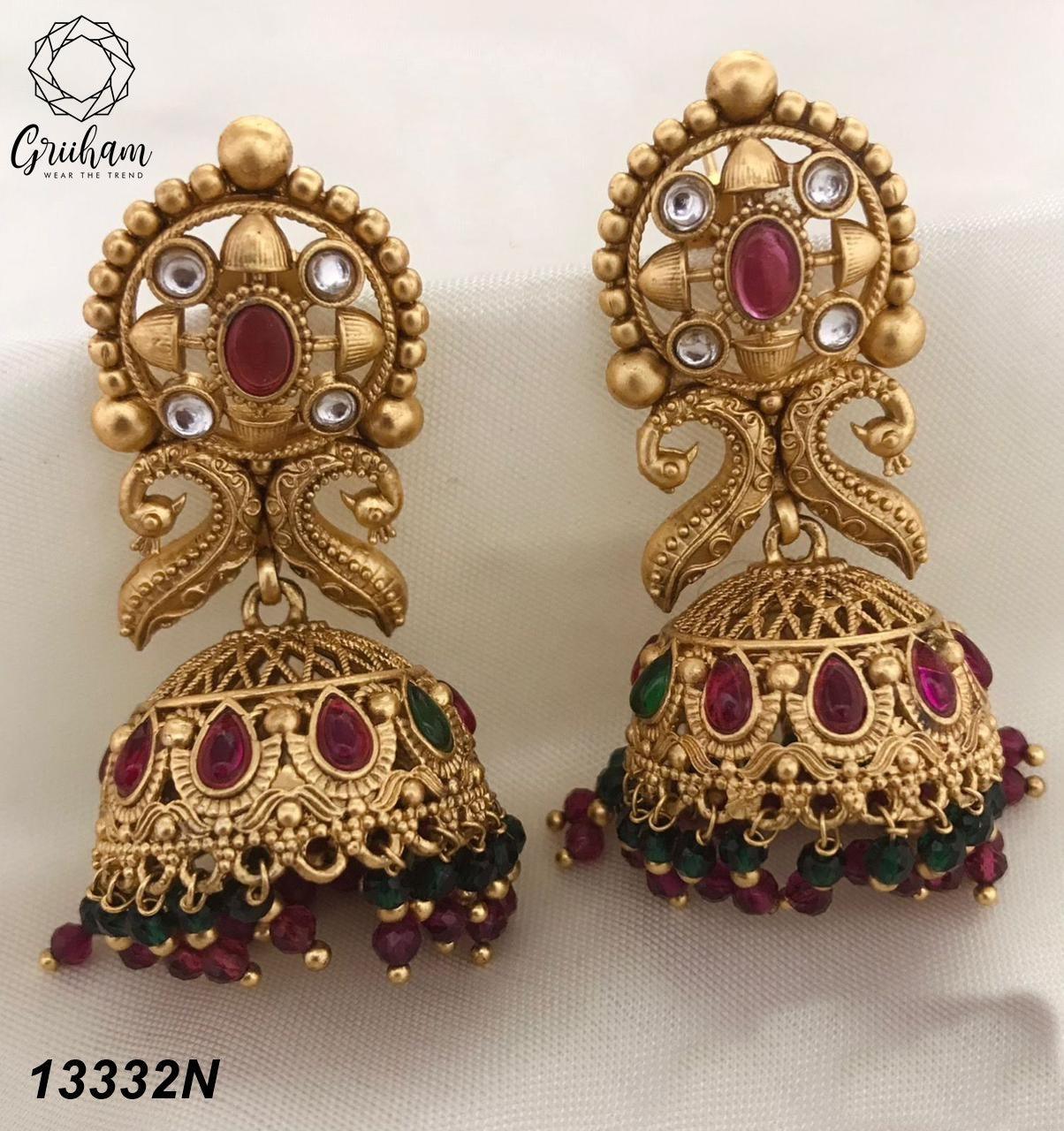 Gold plated Temple design Jhumka Earrings - Griiham