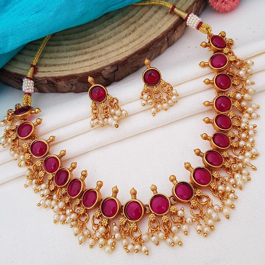 Premium Gold Finish Elegant Chic Necklace set with pearls and red AD Stones 5943N